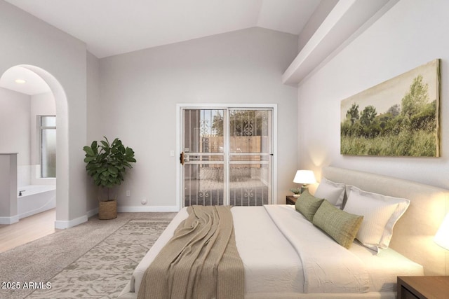 bedroom featuring ensuite bathroom, lofted ceiling, light carpet, and access to exterior