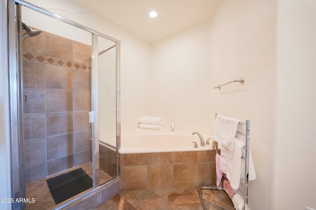 bathroom with separate shower and tub