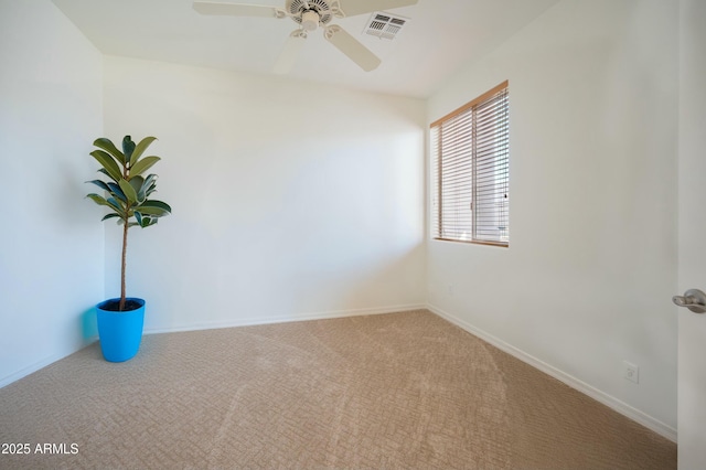 carpeted empty room featuring ceiling fan