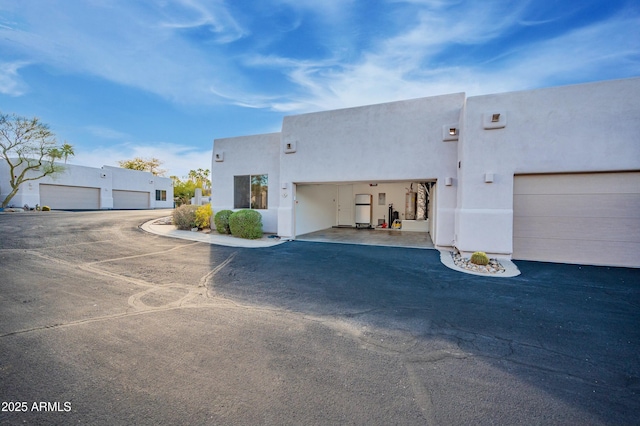 adobe home featuring a garage