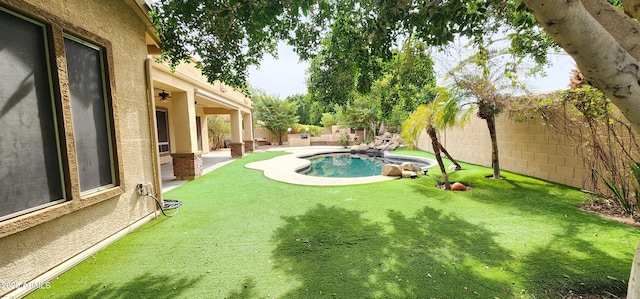 view of yard with a fenced backyard and a fenced in pool