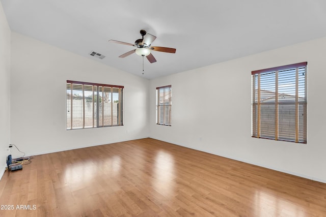 30215 N Joshua Tree Dr, Florence, AZ 85132 - unfurnished room featuring wood finished floors, ceiling fan, and vaulted ceiling
