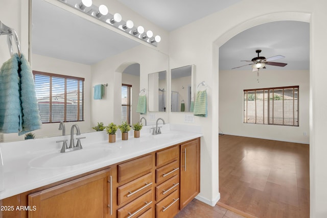 30215 N Joshua Tree Dr, Florence, AZ 85132 - full bathroom featuring a ceiling fan, double vanity, plenty of natural light, and wood finished floors
