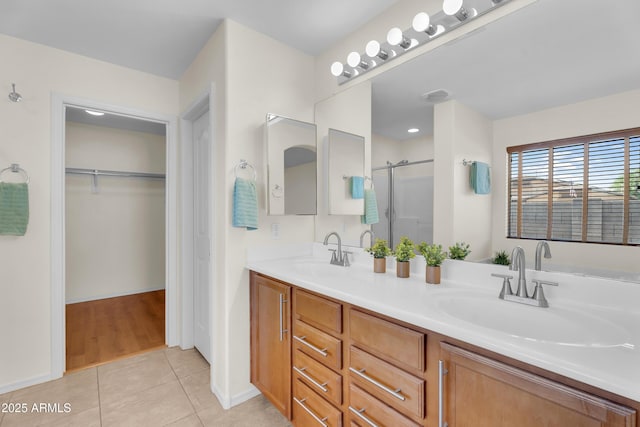 30215 N Joshua Tree Dr, Florence, AZ 85132 - full bath featuring tile patterned floors, a stall shower, a walk in closet, and double vanity