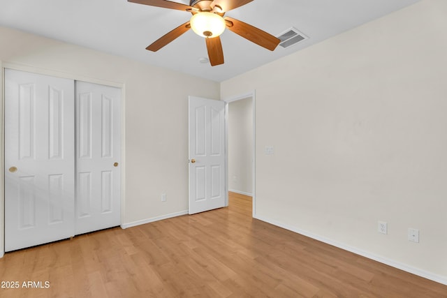 30215 N Joshua Tree Dr, Florence, AZ 85132 - unfurnished bedroom featuring light wood-style floors, a closet, and ceiling fan