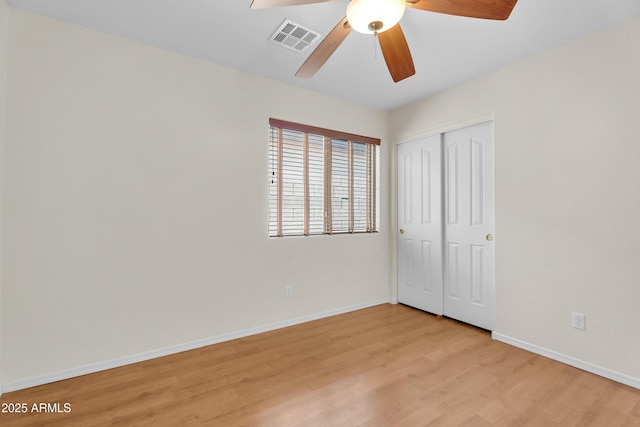 30215 N Joshua Tree Dr, Florence, AZ 85132 - unfurnished bedroom featuring light wood-style flooring, a closet, and a ceiling fan