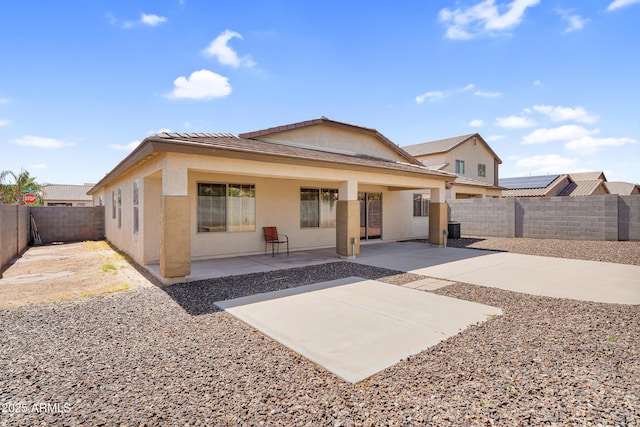 30215 N Joshua Tree Dr, Florence, AZ 85132 - back of property featuring a patio, a fenced backyard, and stucco siding