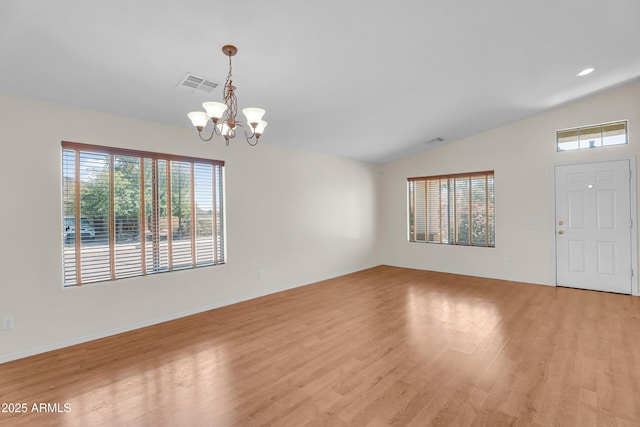 30215 N Joshua Tree Dr, Florence, AZ 85132 - entryway featuring healthy amount of natural light, a chandelier, vaulted ceiling, and light wood-type flooring