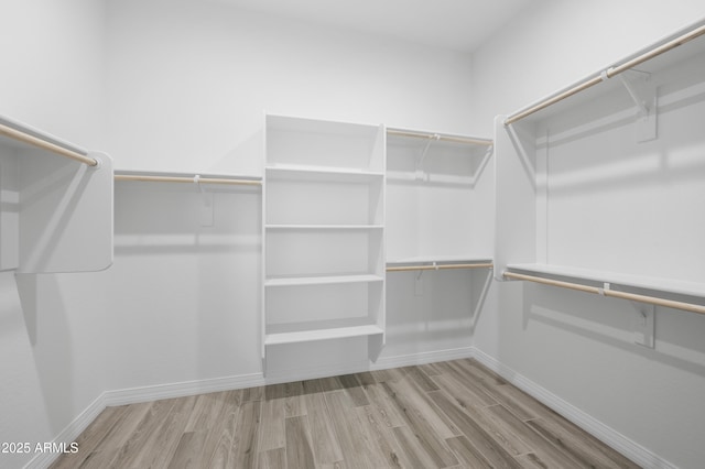 spacious closet with wood finished floors