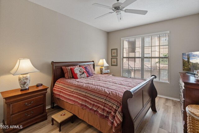 bedroom featuring light carpet and ceiling fan