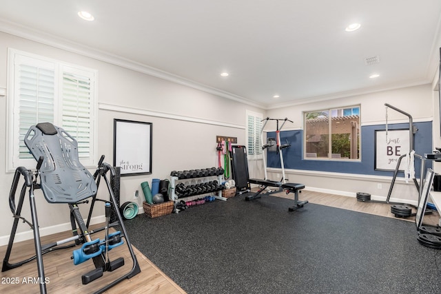 exercise room with crown molding, recessed lighting, and baseboards