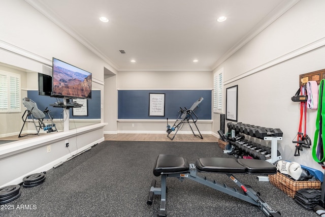 exercise room with recessed lighting, baseboards, and crown molding