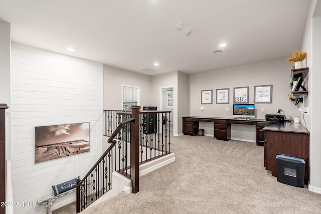 home office featuring visible vents, recessed lighting, baseboards, light colored carpet, and built in study area