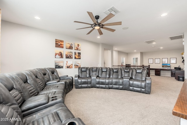 living area with recessed lighting, visible vents, and carpet flooring