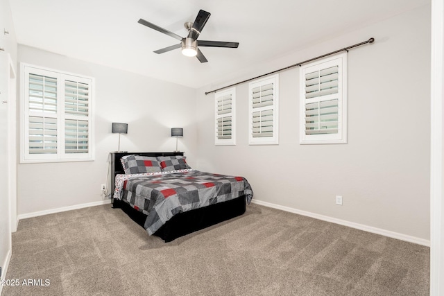 bedroom featuring baseboards, a ceiling fan, and carpet flooring