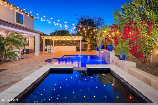 outdoor pool featuring outdoor dry bar, an in ground hot tub, a pergola, and a patio