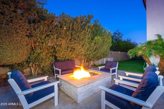 view of patio / terrace featuring an outdoor fire pit and a fenced backyard