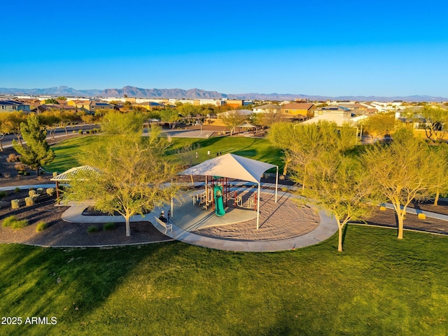 surrounding community featuring a residential view, a lawn, a mountain view, and playground community