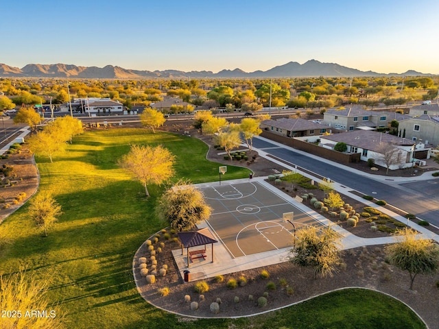 birds eye view of property with a mountain view and a residential view