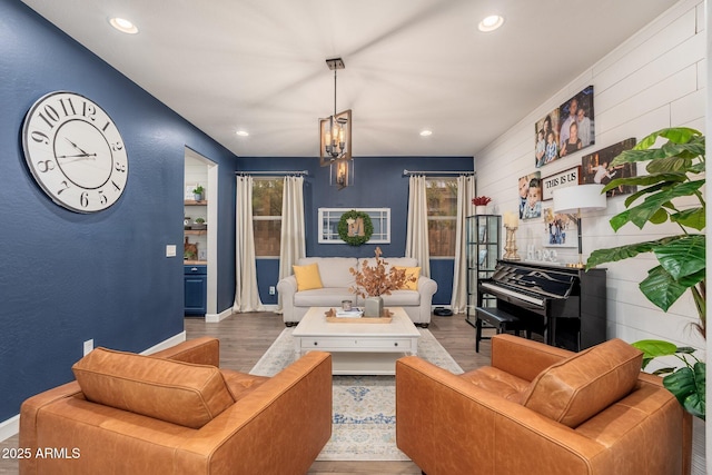 living room with recessed lighting, baseboards, and wood finished floors