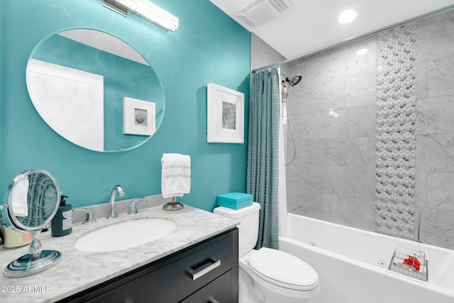 bathroom featuring toilet, vanity, shower / bath combination with curtain, and visible vents