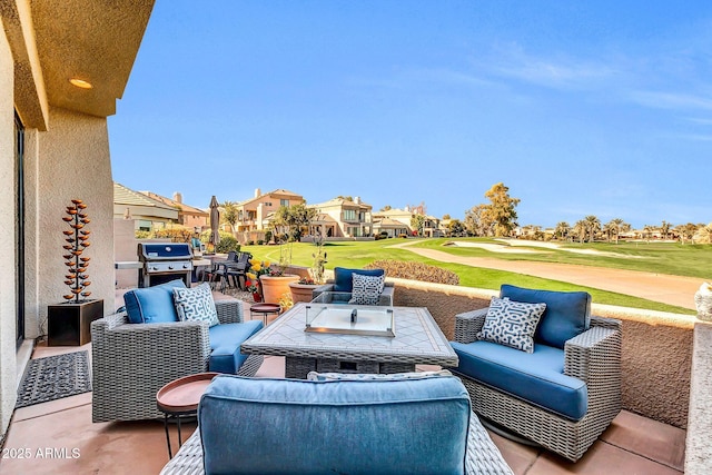 view of patio / terrace featuring view of golf course, an outdoor hangout area, and grilling area