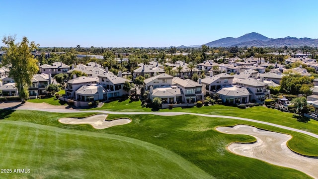 aerial view featuring a residential view, a mountain view, and golf course view