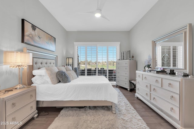 bedroom with ceiling fan and dark wood-type flooring