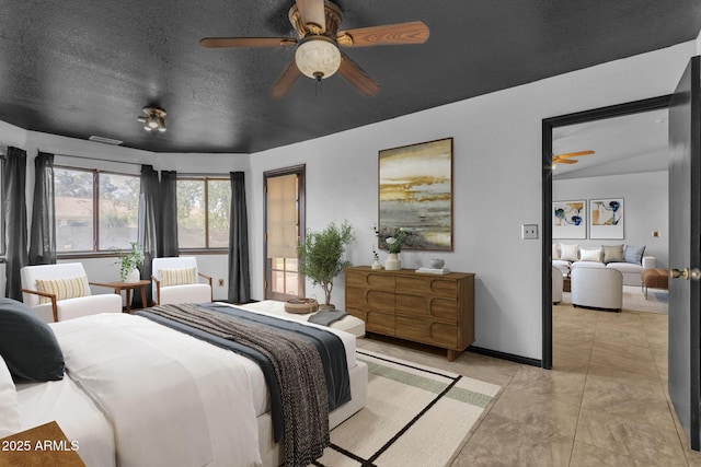 15210 S Country Club Way, Arizona City, AZ 85123 - bedroom with ceiling fan, a textured ceiling, and baseboards