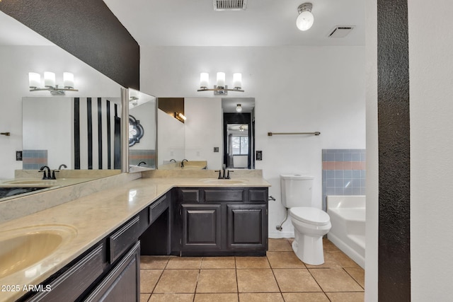 15210 S Country Club Way, Arizona City, AZ 85123 - bathroom with tile patterned floors, toilet, a sink, double vanity, and a bath