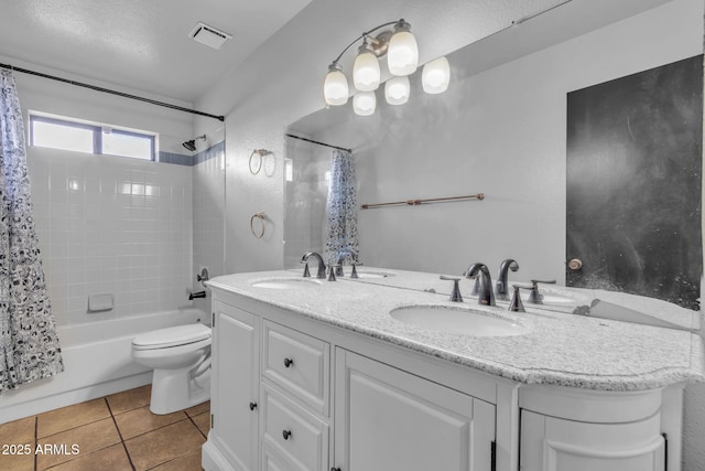 15210 S Country Club Way, Arizona City, AZ 85123 - full bath featuring tile patterned flooring, visible vents, toilet, double vanity, and a sink