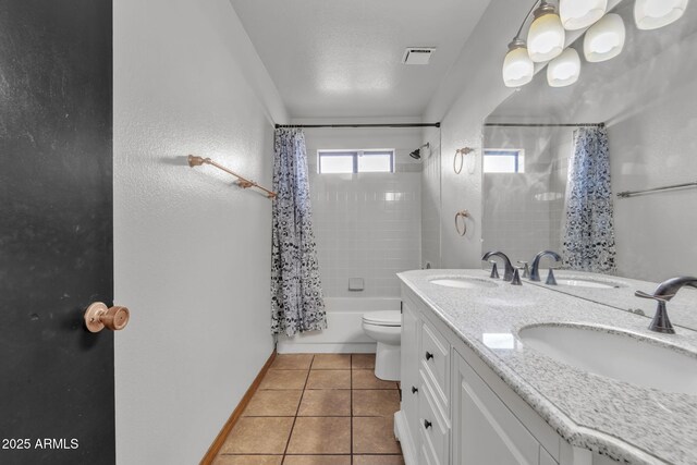 15210 S Country Club Way, Arizona City, AZ 85123 - bathroom featuring visible vents, shower / bath combo with shower curtain, a sink, tile patterned flooring, and double vanity
