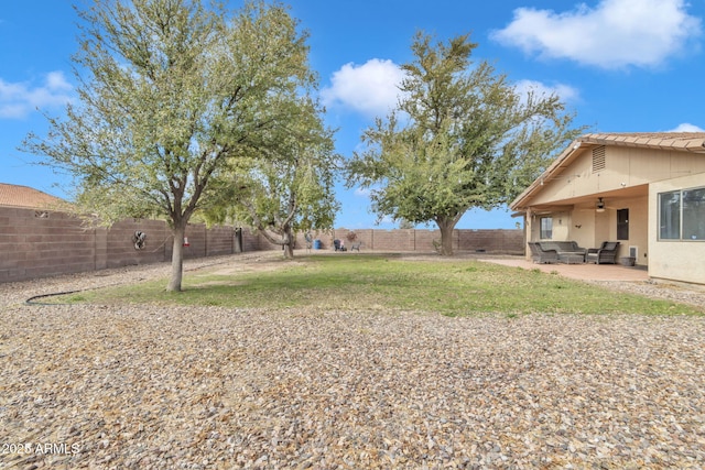 15210 S Country Club Way, Arizona City, AZ 85123 - view of yard featuring a fenced backyard, a patio, an outdoor hangout area, and a ceiling fan