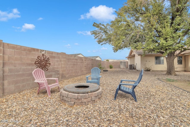15210 S Country Club Way, Arizona City, AZ 85123 - view of yard featuring cooling unit, a fire pit, and a fenced backyard