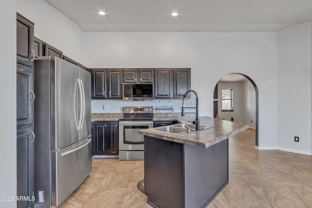 15210 S Country Club Way, Arizona City, AZ 85123 - kitchen featuring a sink, stainless steel appliances, arched walkways, and recessed lighting