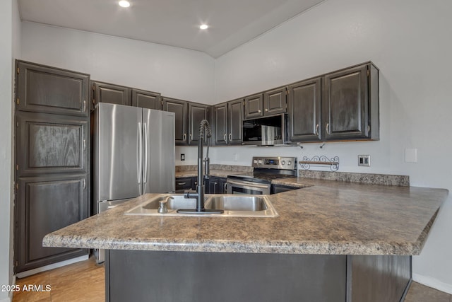 15210 S Country Club Way, Arizona City, AZ 85123 - kitchen with high vaulted ceiling, a sink, recessed lighting, stainless steel appliances, and a peninsula