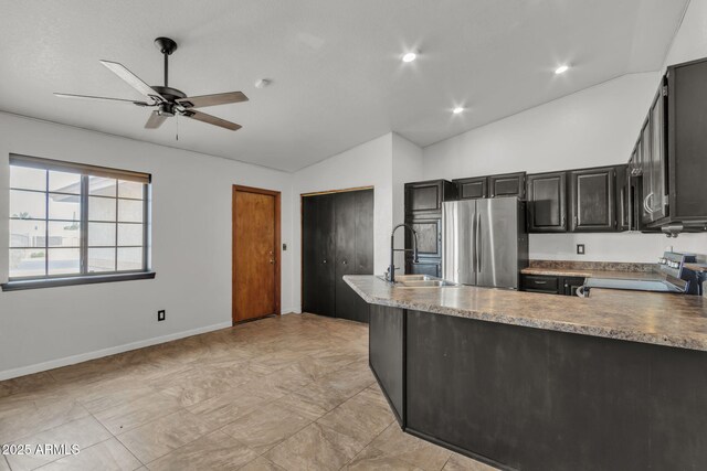 15210 S Country Club Way, Arizona City, AZ 85123 - kitchen featuring freestanding refrigerator, ceiling fan, a sink, stove, and vaulted ceiling