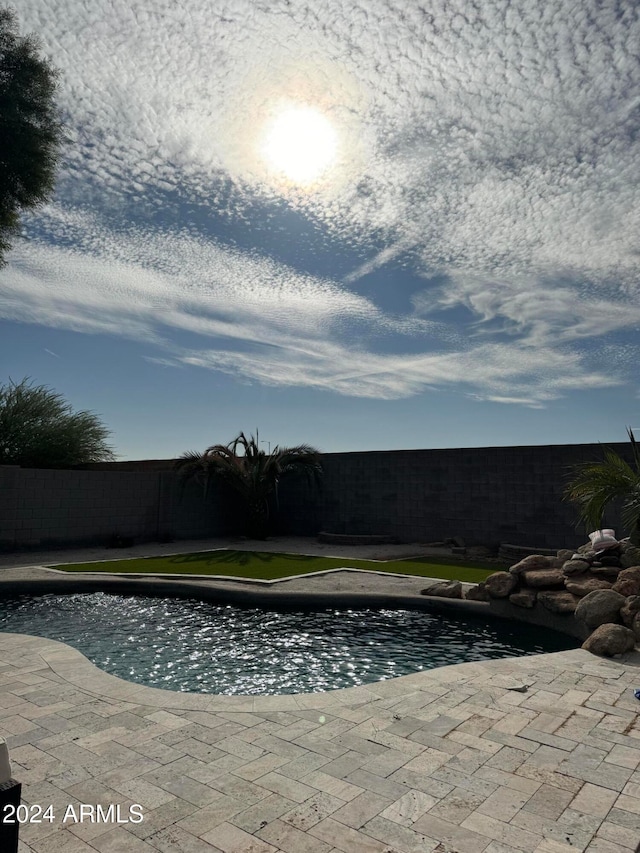 view of pool featuring a patio