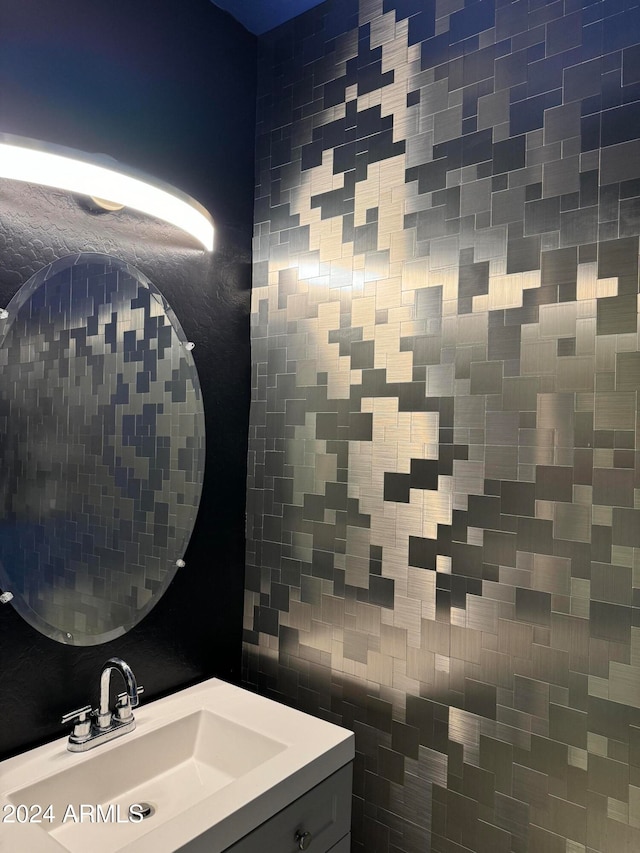 bathroom with tile walls and vanity