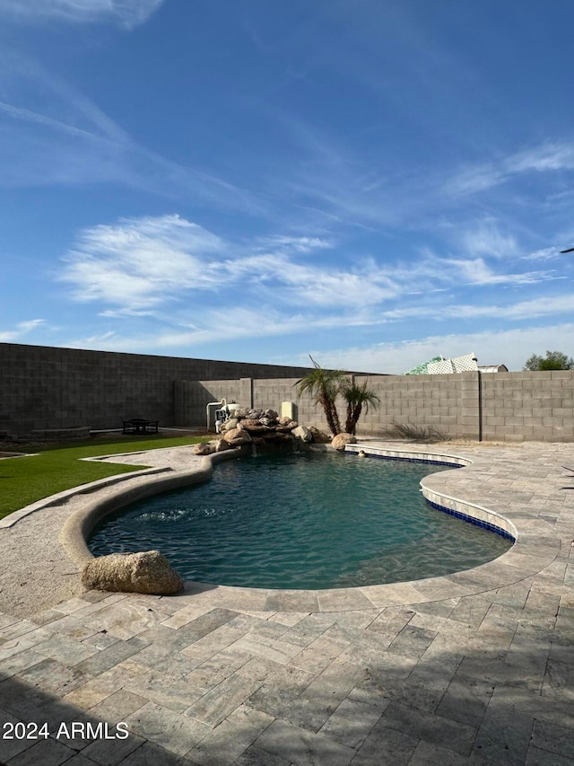 view of swimming pool with a patio