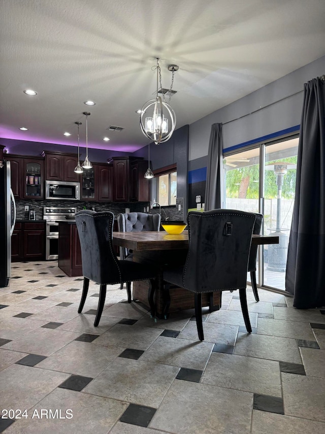 dining area with a chandelier