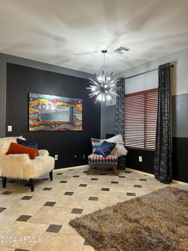 sitting room featuring an inviting chandelier