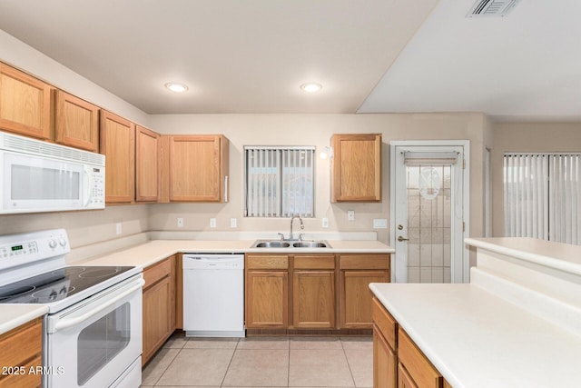 8271 W Cypress Point Cir, Arizona City, AZ 85123 - kitchen featuring white appliances, light countertops, light tile patterned floors, and recessed lighting