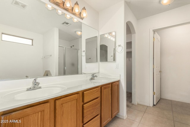 8271 W Cypress Point Cir, Arizona City, AZ 85123 - full bath featuring a shower stall, double vanity, and tile patterned flooring
