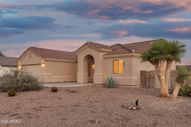 8271 W Cypress Point Cir, Arizona City, AZ 85123 - mediterranean / spanish home featuring stucco siding, a tile roof, and a garage