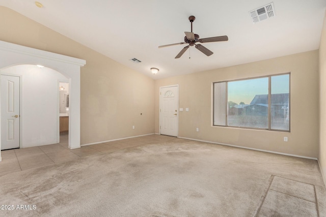 8271 W Cypress Point Cir, Arizona City, AZ 85123 - carpeted empty room with vaulted ceiling, a ceiling fan, and arched walkways