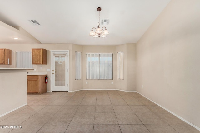 8271 W Cypress Point Cir, Arizona City, AZ 85123 - unfurnished dining area featuring a chandelier and light tile patterned flooring
