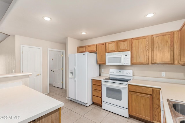 8271 W Cypress Point Cir, Arizona City, AZ 85123 - kitchen featuring white appliances, light tile patterned floors, light countertops, and recessed lighting