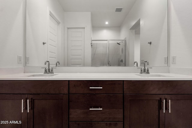 3842 E Bartlett Way, Chandler, AZ 85249 - bathroom featuring double vanity, a stall shower, and recessed lighting