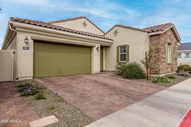 3842 E Bartlett Way, Chandler, AZ 85249 - mediterranean / spanish-style house featuring decorative driveway, stucco siding, a garage, and a tiled roof